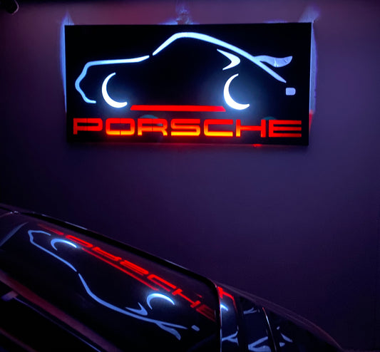 Décoration murale Porsche 911 en métal noir avec rétroéclairage LED, silhouette emblématique de voiture sportive, design automobile contemporain pour garage ou intérieur.

